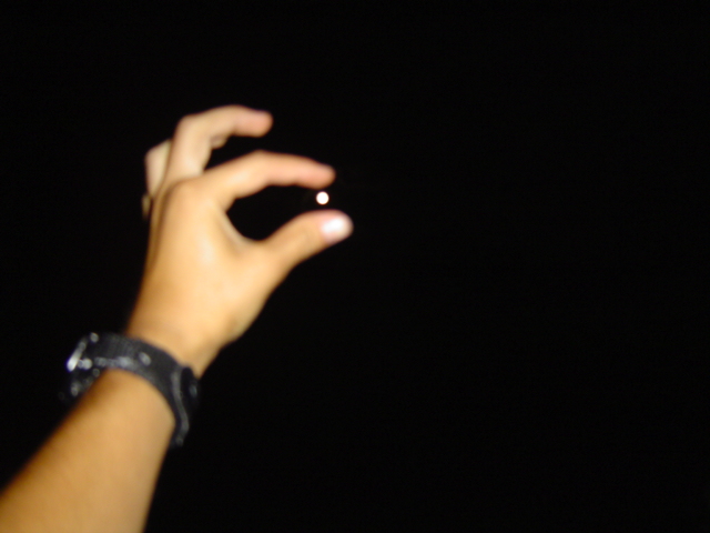 Sherae holding the moon in her finger tips